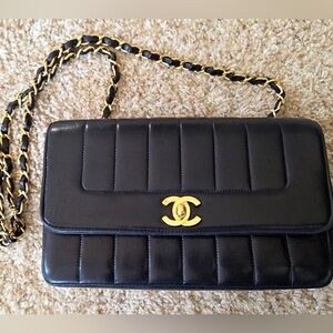 Chanel Quilted vertical Black lambskin Leather Shoulder Bag with Gold Chain